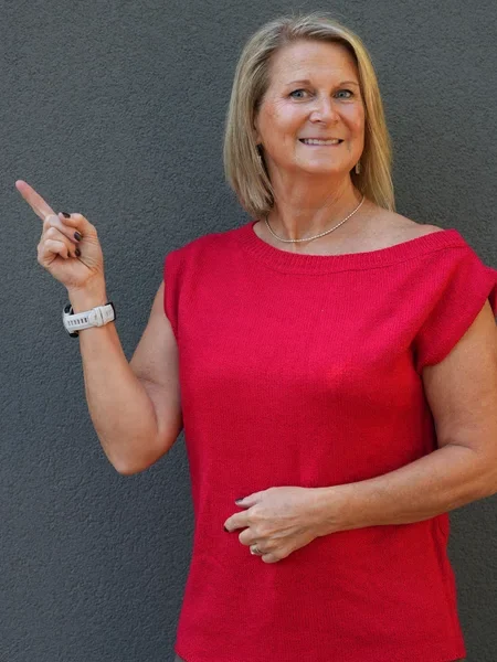 Tracy Lombardy pointing to the marketing solutions above
